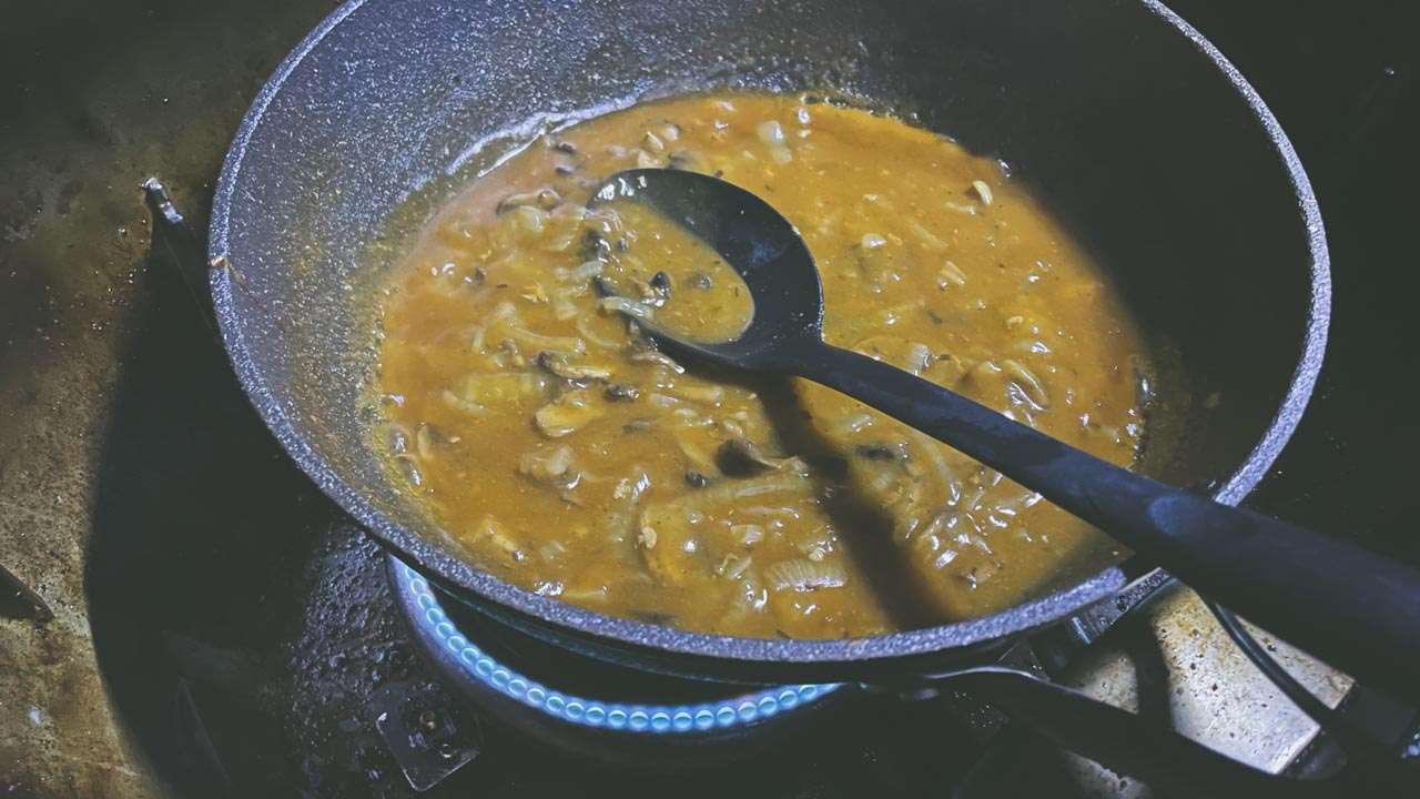 Pork Chop Gravy Being Thickened Before Serving