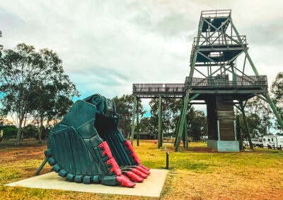 Digger Bucket In Front Of Poppet Head At Cooinda Park Wyalong